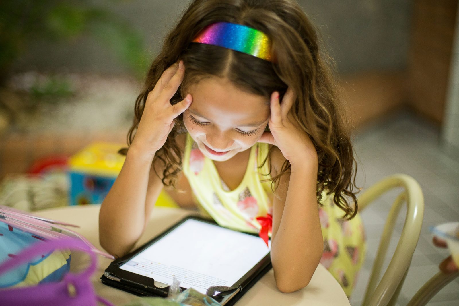 Child using a tablet to learn