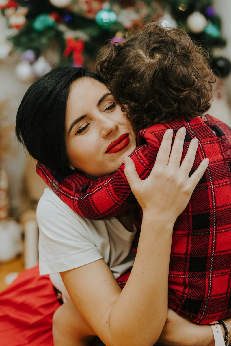 Parent embracing a child